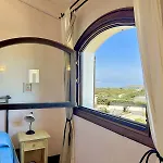 With A Private Free Sun Bed And Umbrellas